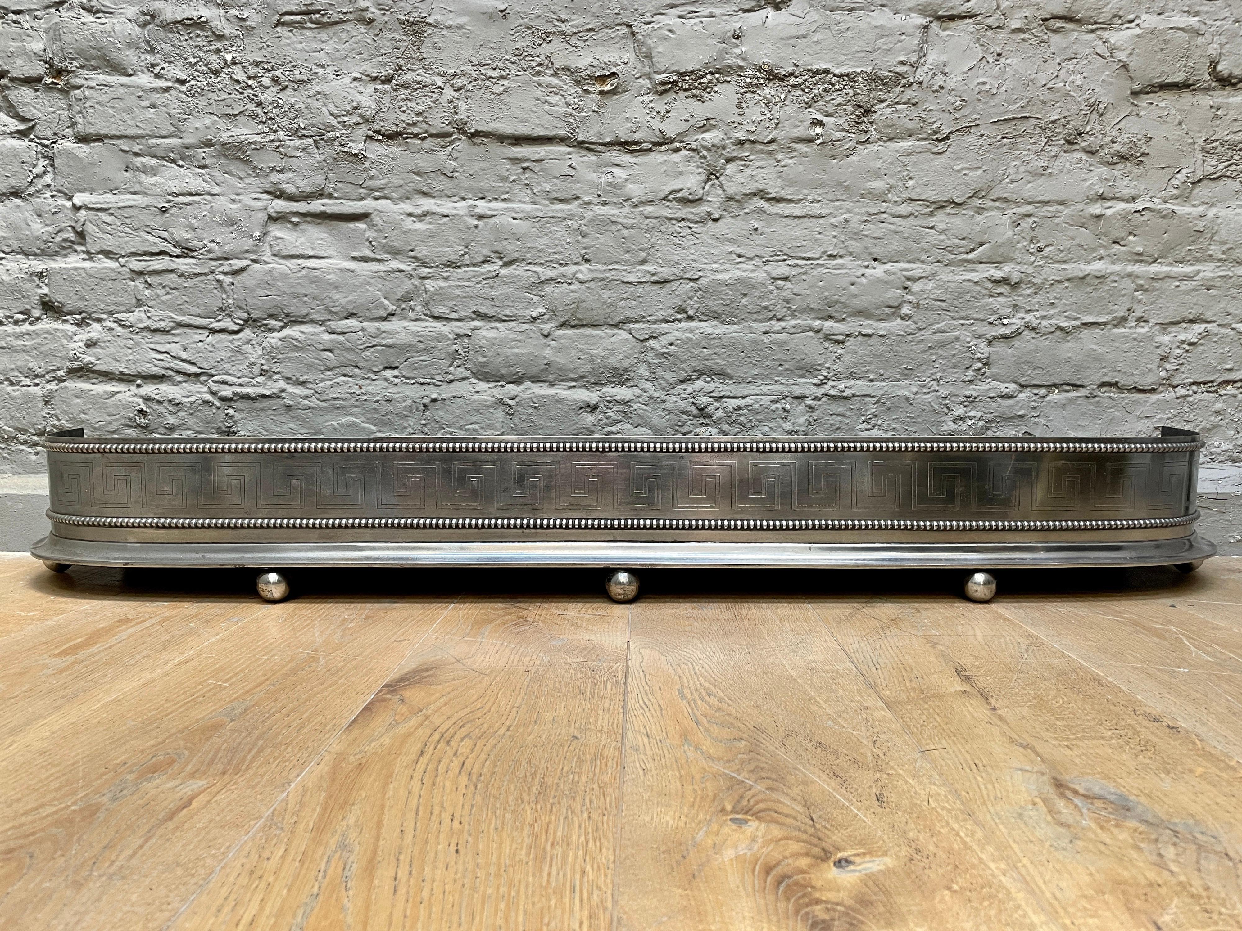 An Antique English Regency Engraved Steel Fender For Sale 1