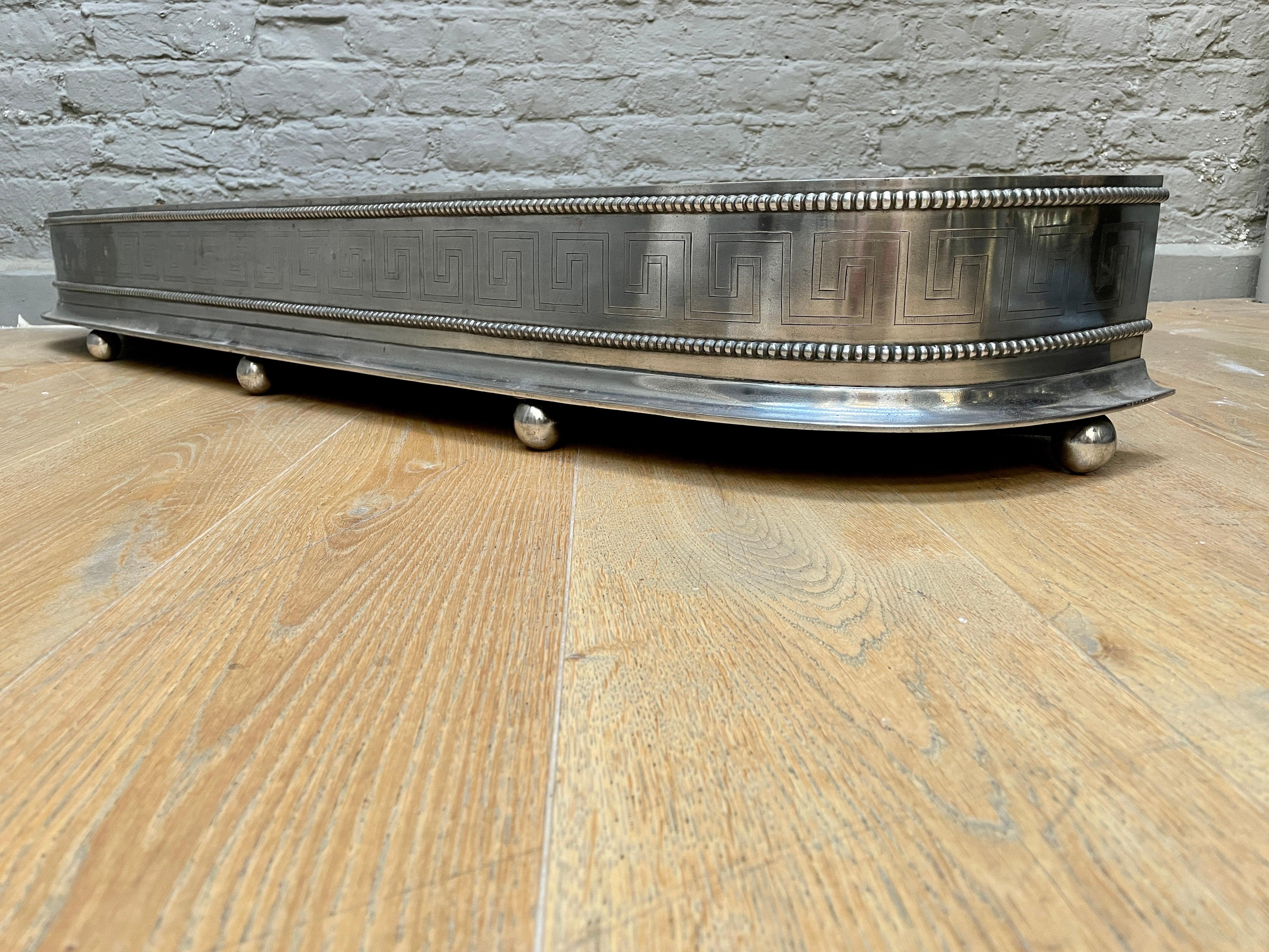 An Antique English Regency Engraved Steel Fender For Sale 2