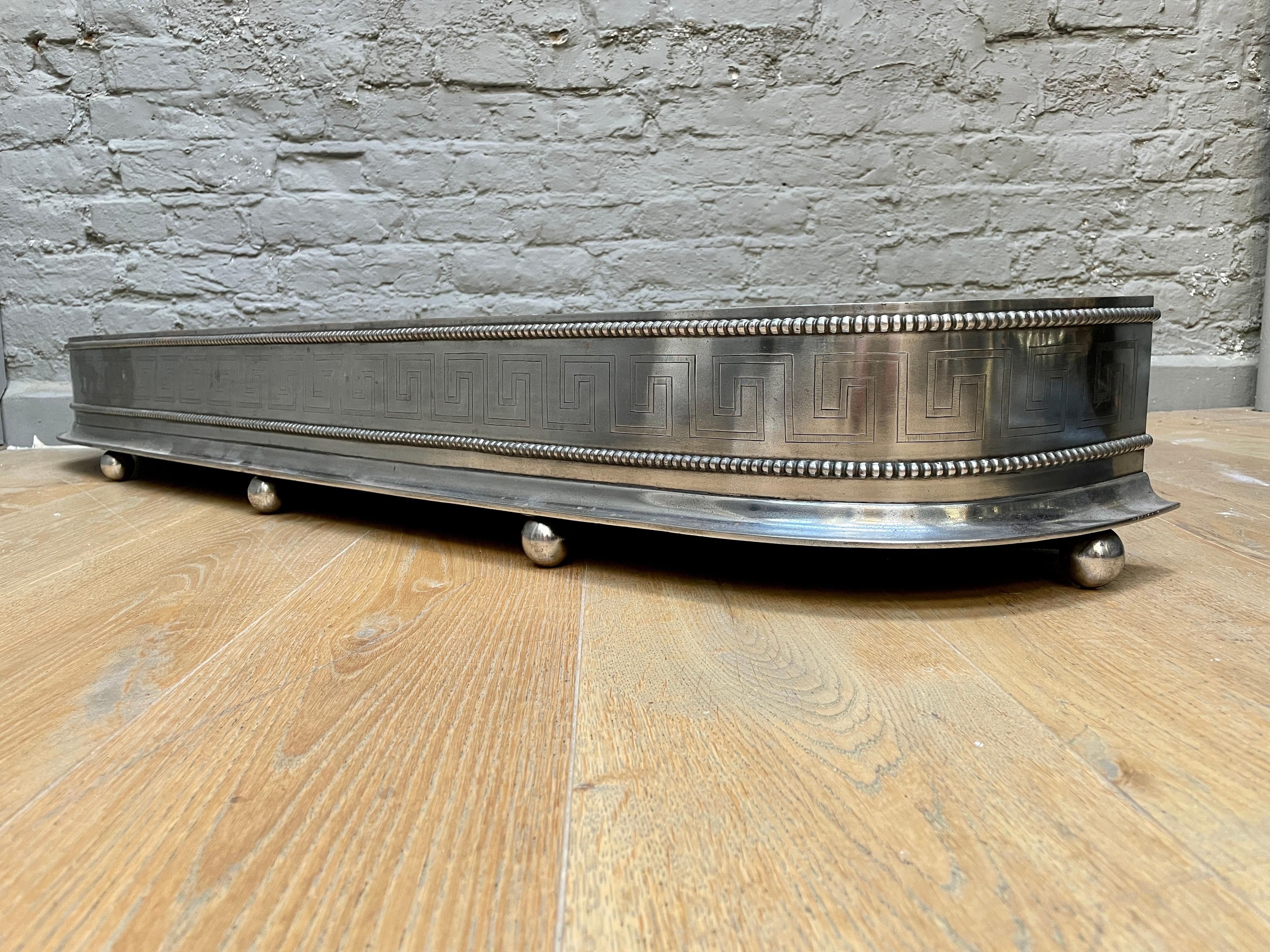 An Antique English Regency Engraved Steel Fender For Sale 3