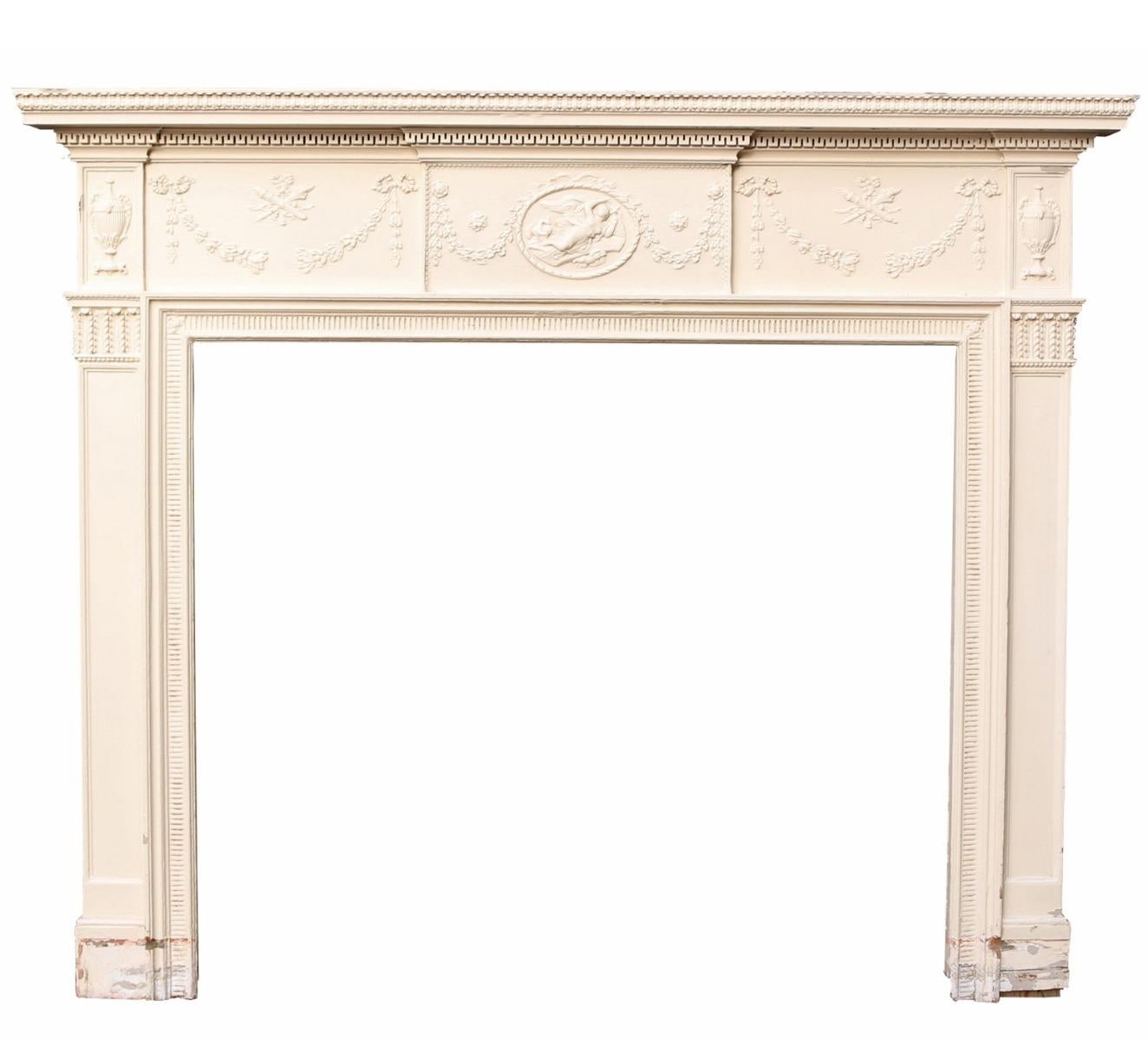 A late Georgian or Regency period painted pine and gesso / composition fire surround. This was salvaged from a house in Dorchester.

Additional Dimensions:

Opening height 115.5 cm

Opening width 132.5 cm

Width between outside of legs 175.5