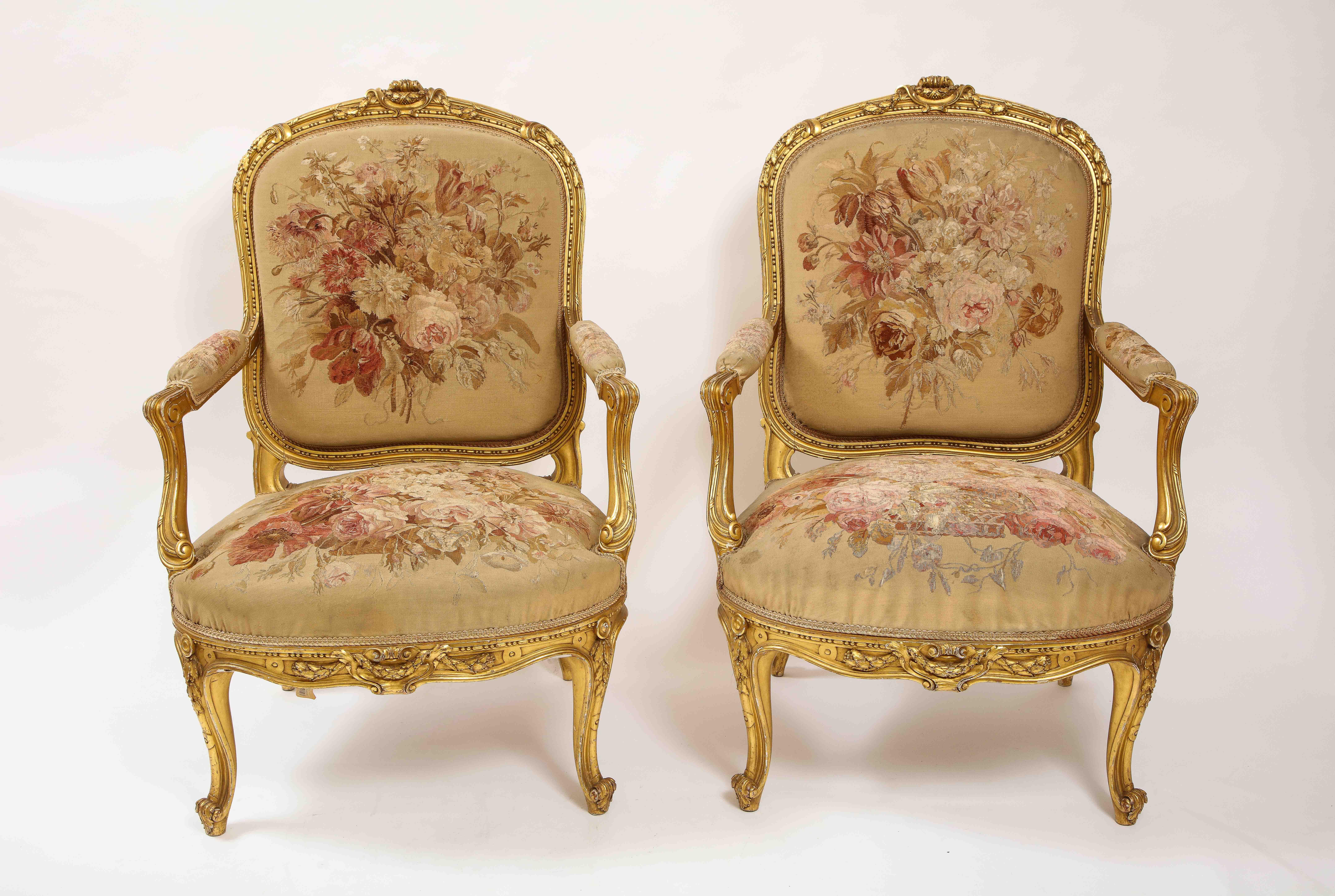 An Antique French 19th Century Louis XVI Style Five Piece Royal Giltwood and Aubusson Complete Suite with Canapé and four side-chairs, Attributed to Linke. This suite comprises of a canapé and four side-chairs. Each piece is made up of