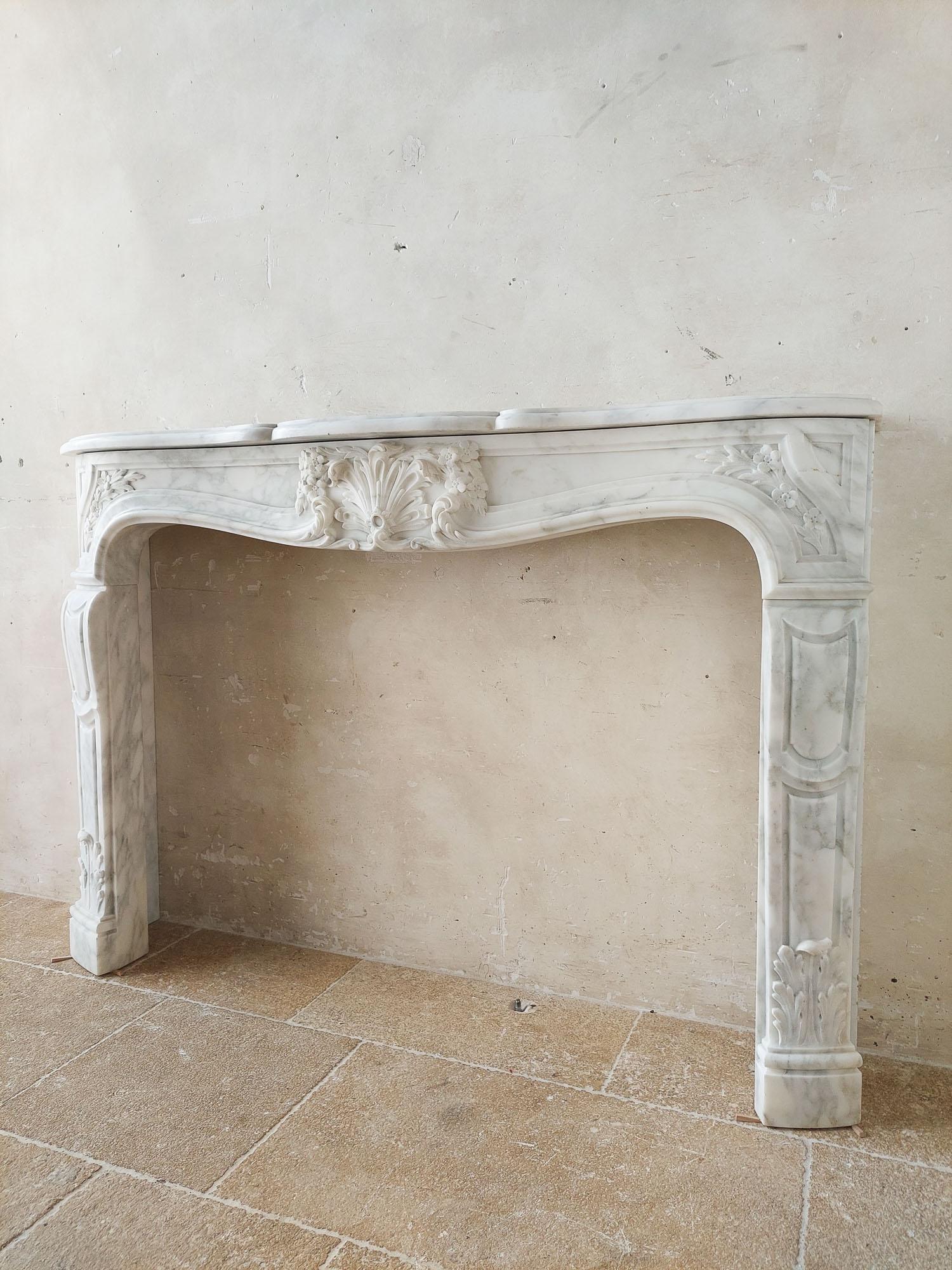 19th Century An Antique French Beautifully Carved Carrara Marble Fireplace with Coquille For Sale