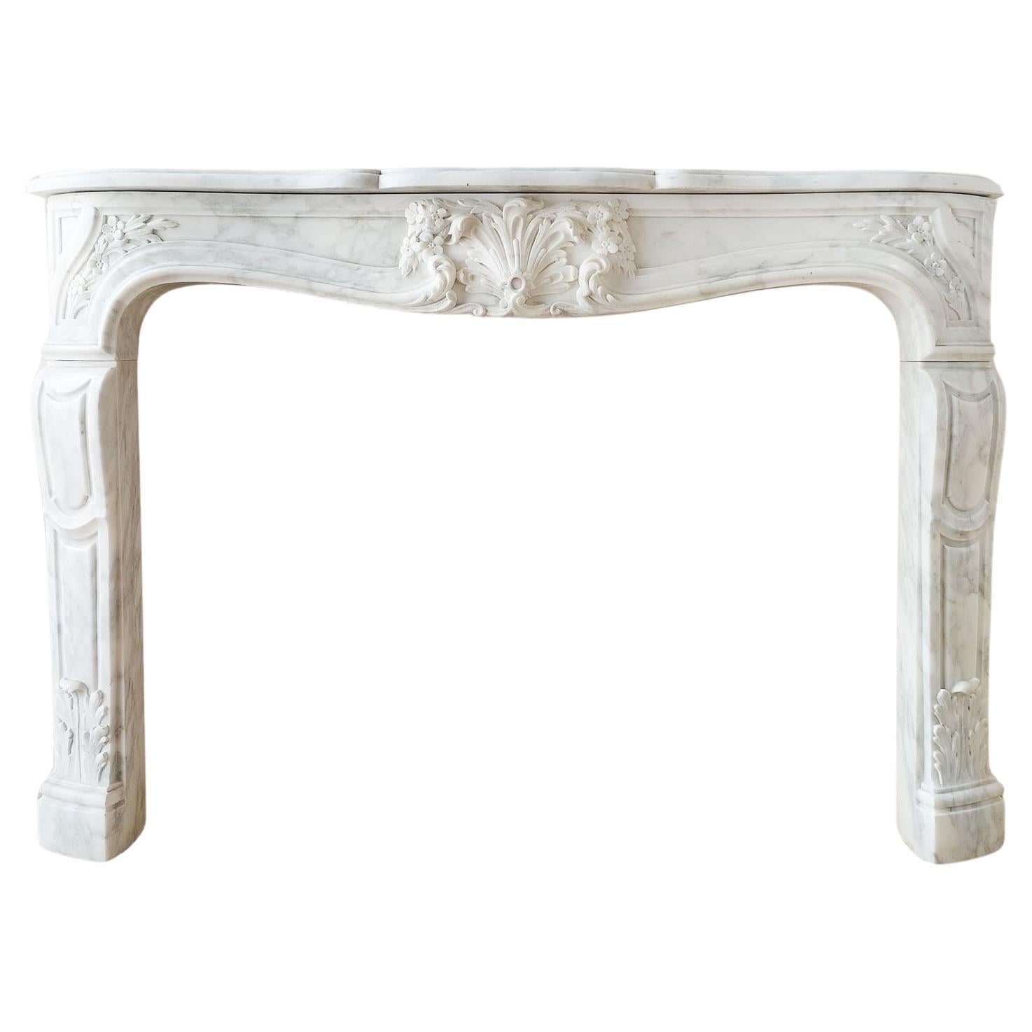 An Antique French Beautifully Carved Carrara Marble Fireplace with Coquille For Sale