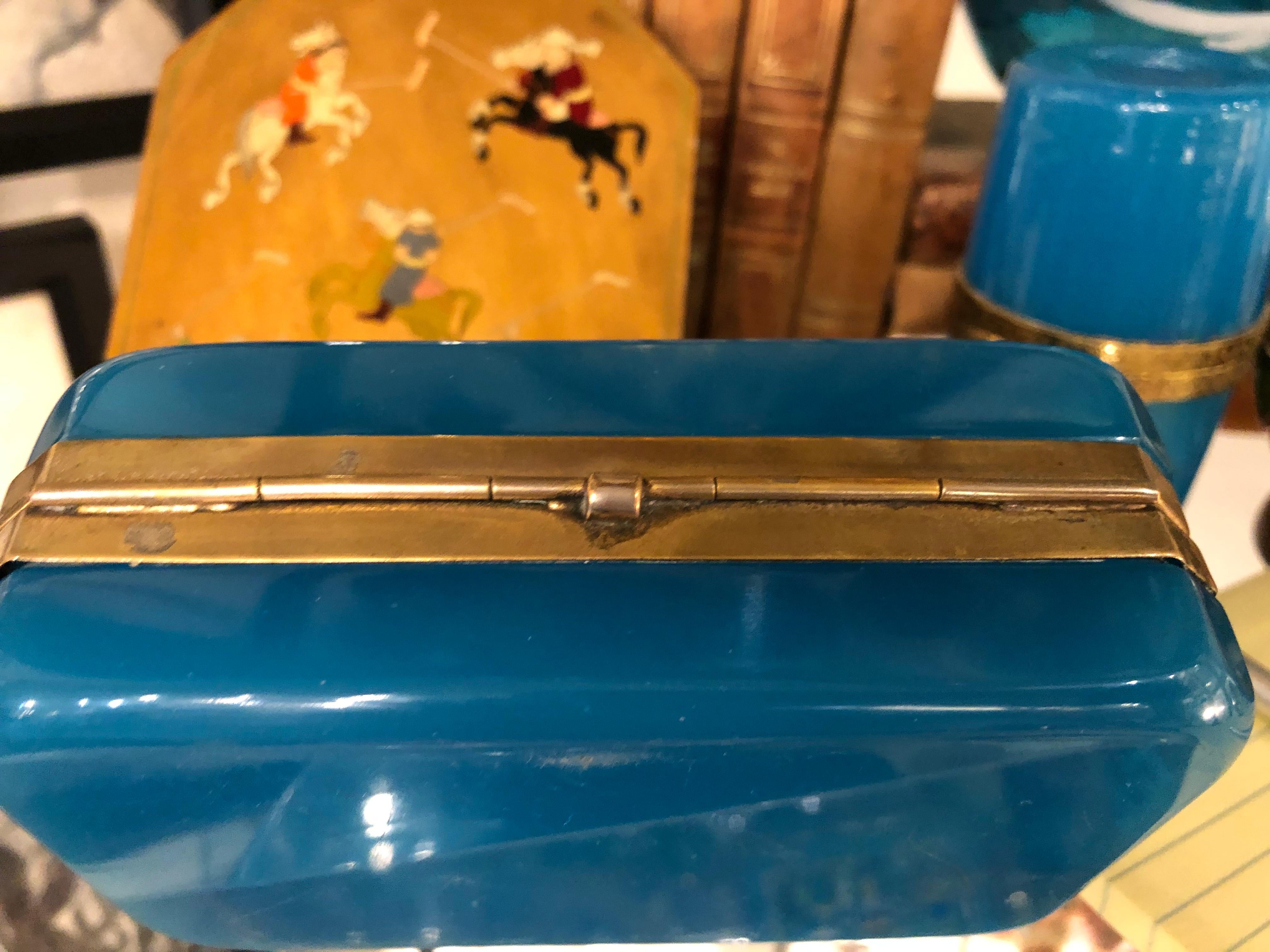 A 19th century French blue opaline glass casket having a doré bronze hinge and banding.