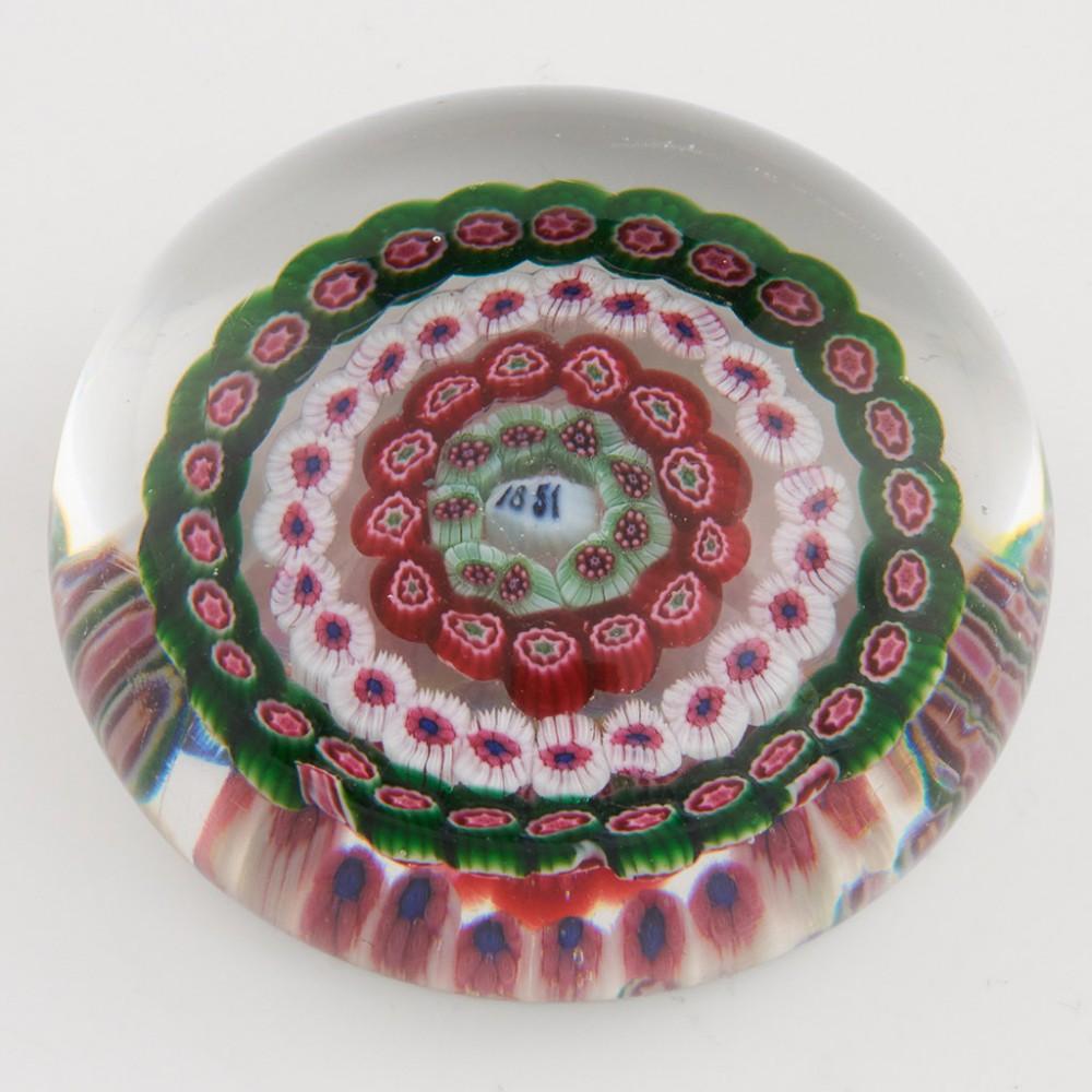 An Antique French Cane Paperweight, 1851

Additional information:
Date : 1851
Origin : France, probably Baccarat
Features : Four rows of concentric canes around an 1851 date cane
Marks : None
Type : Lead
Size : Diameter 6.2 cm 
Condition :