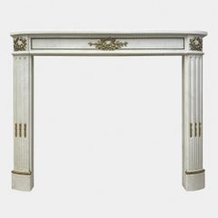 An Antique French Empire Statuary White Marble and Ormolu Fireplace Mantel