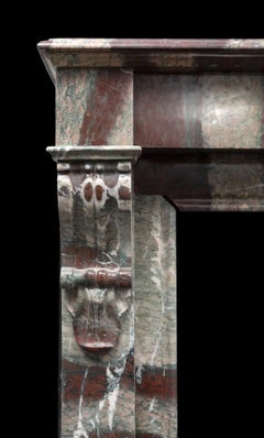 An antique French fireplace surround made from ‘Campan Grand Melange’ marble.