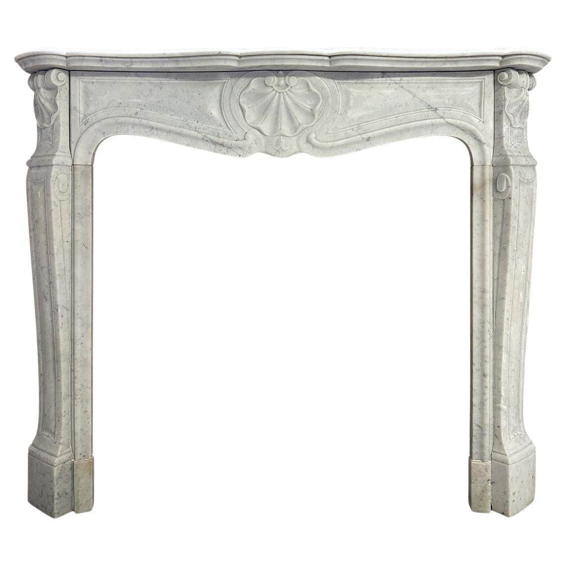 An Antique French Louis XV Style Carrara Marble Fireplace Mantel  For Sale