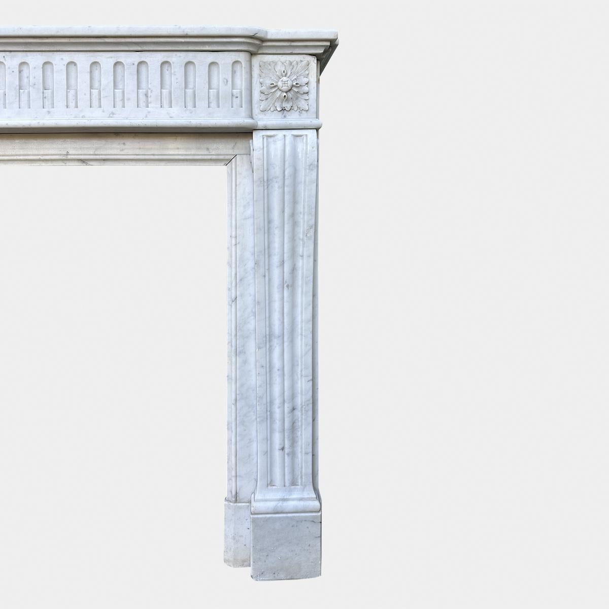 Hand-Carved An Antique French Louis XVI Style Carrara Marble Fireplace Mantel  For Sale