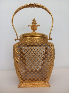 An antique French ormolu and glass cookie jar or ice bucket