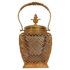 An antique French ormolu and glass cookie jar or ice bucket