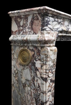 An antique French Régence style, Breccia Violetta marble mantel / fireplace