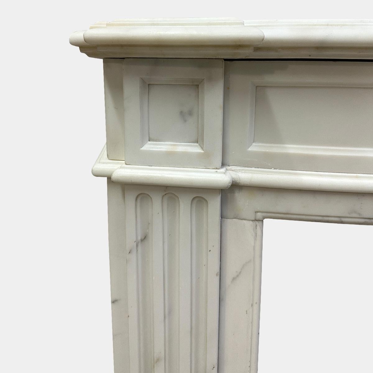 Hand-Carved An Antique French Statuary White Marble Louis XVI Style Fireplace mantel For Sale