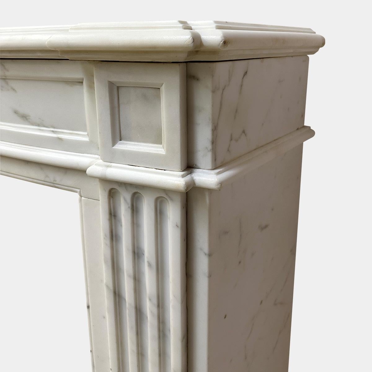 Late 19th Century An Antique French Statuary White Marble Louis XVI Style Fireplace mantel For Sale