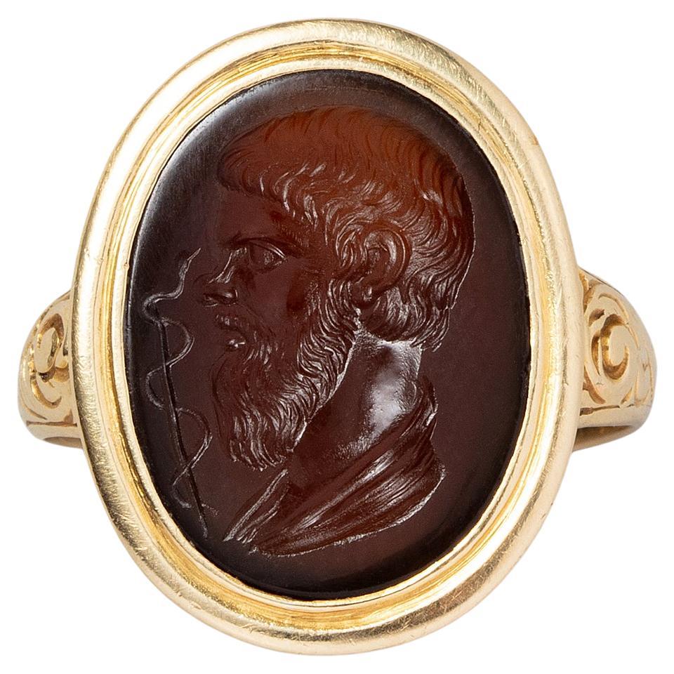 An Antique Gold Ring with an Intaglio of Asclepios For Sale