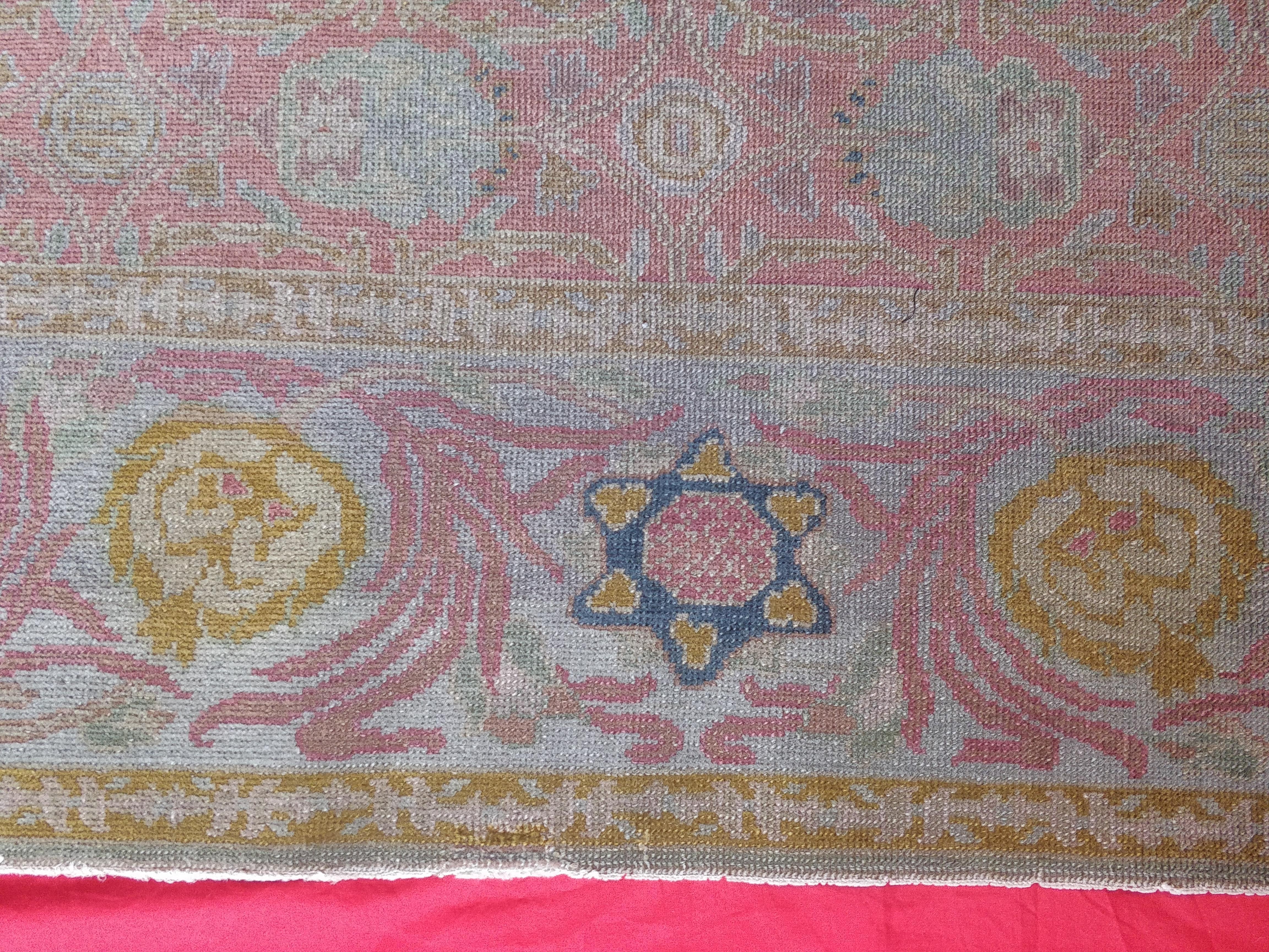 Antique Israelei Bezalel carpet produced in the early mid-20th century in the New Art School in Jerusalem. This exemplary is rich the Judaica symbol.
Wool pile, cotton warp and weft. Soft coluours and medallion design. Measures: 242 x 150.
