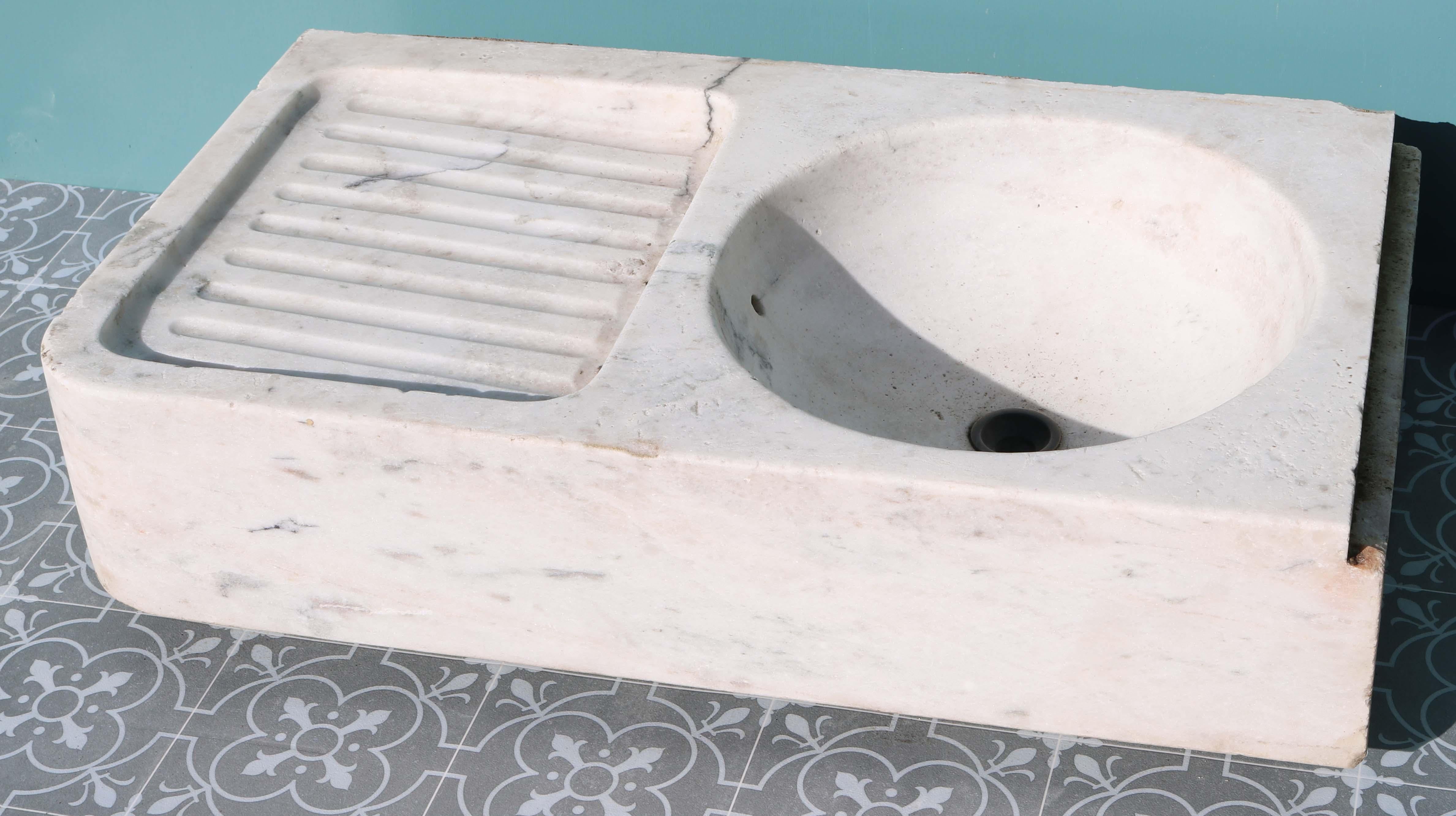 A reclaimed white and grey veined Carrara marble kitchen sink with drainer.

Condition report

Good structural condition. Lightly weathered finish. No cracks or breaks.

Style

Country, Georgian, Italianate, Louis XV, Victorian

Date of