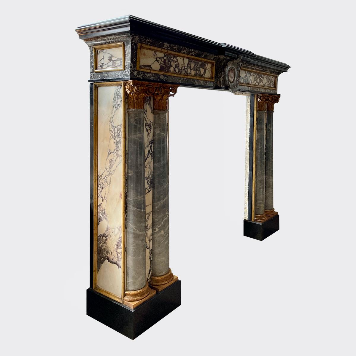 A rare and unusual 19th century Italian Renaissance revival specimen marble chimneypiece of superior quality. The jambs stood on Belgian Black marble foot blocks with Breche panels to front and side returns, both framed with Siena marble mouldings.