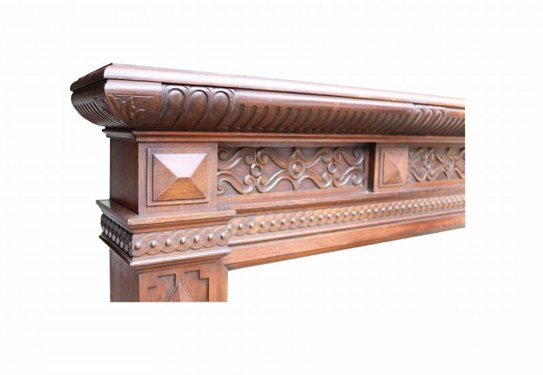 An English Victorian period, Jacobean style fireplace,  salvaged from a house on the Herefordshire, Shropshire border.

Opening Height  107 cm

Opening Width   127 cm.