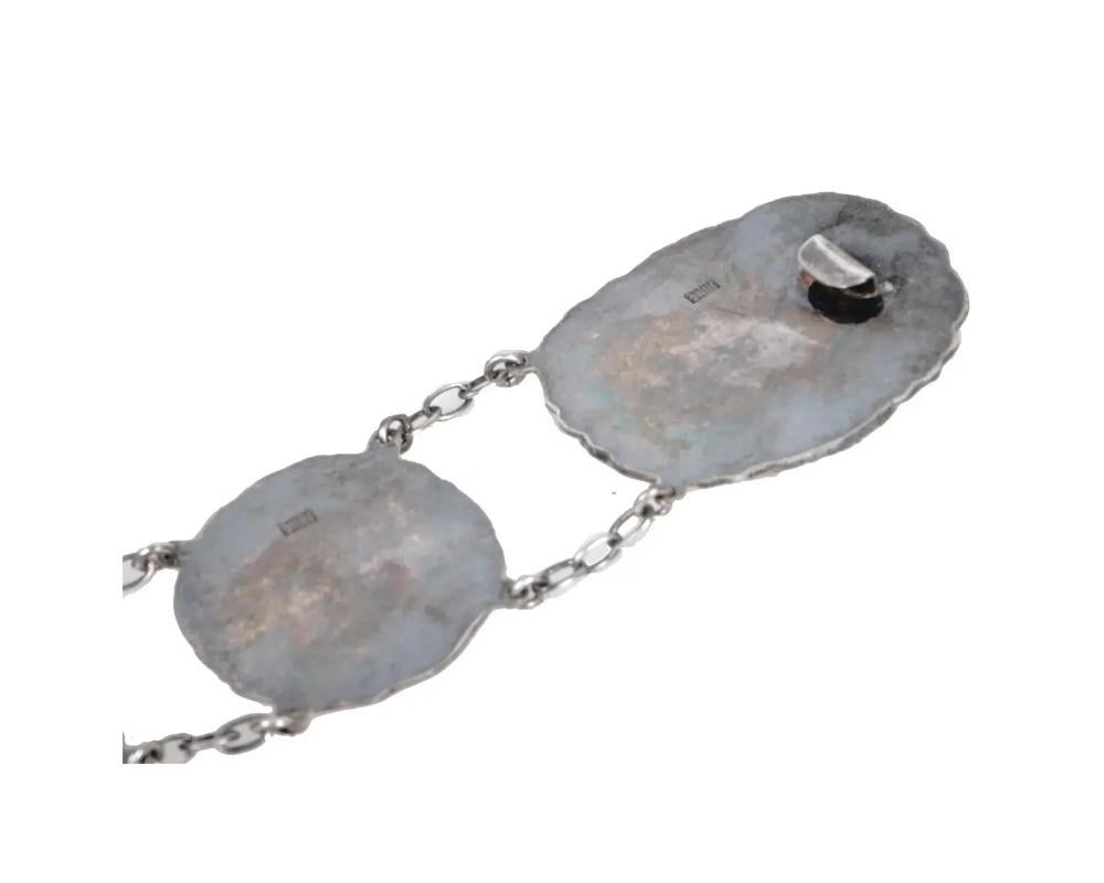 An antique Japanese Meiji period repousse silver belt consisting of buckles link 5