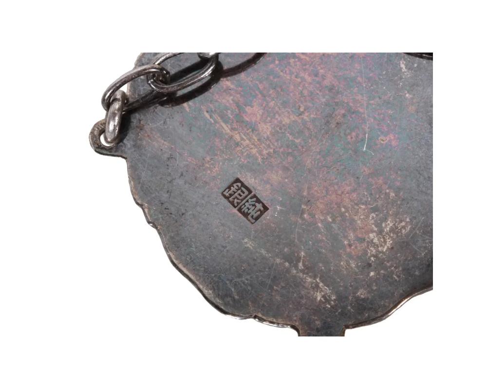 An antique Japanese Meiji period repousse silver belt consisting of buckles link 6