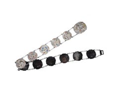 An antique Japanese Meiji period repousse silver belt consisting of buckles link