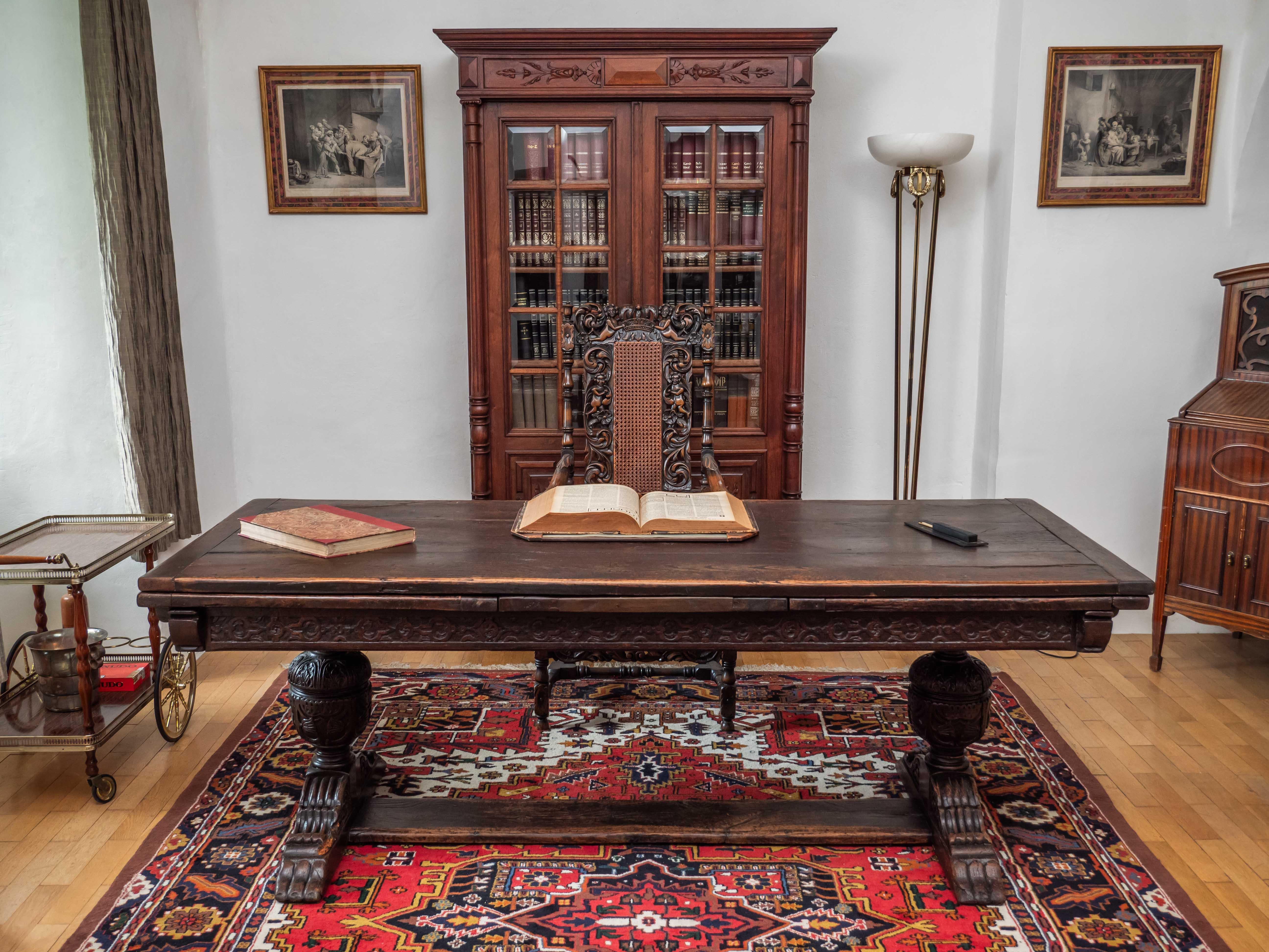 A unique large dining table from a Belgian castle. The table was made at the turn of the 17th and 18th centuries in the Elizabethan style. This table is, as it used to be at the time, very sturdy, made of solid oak. Practical unfolding, when the top