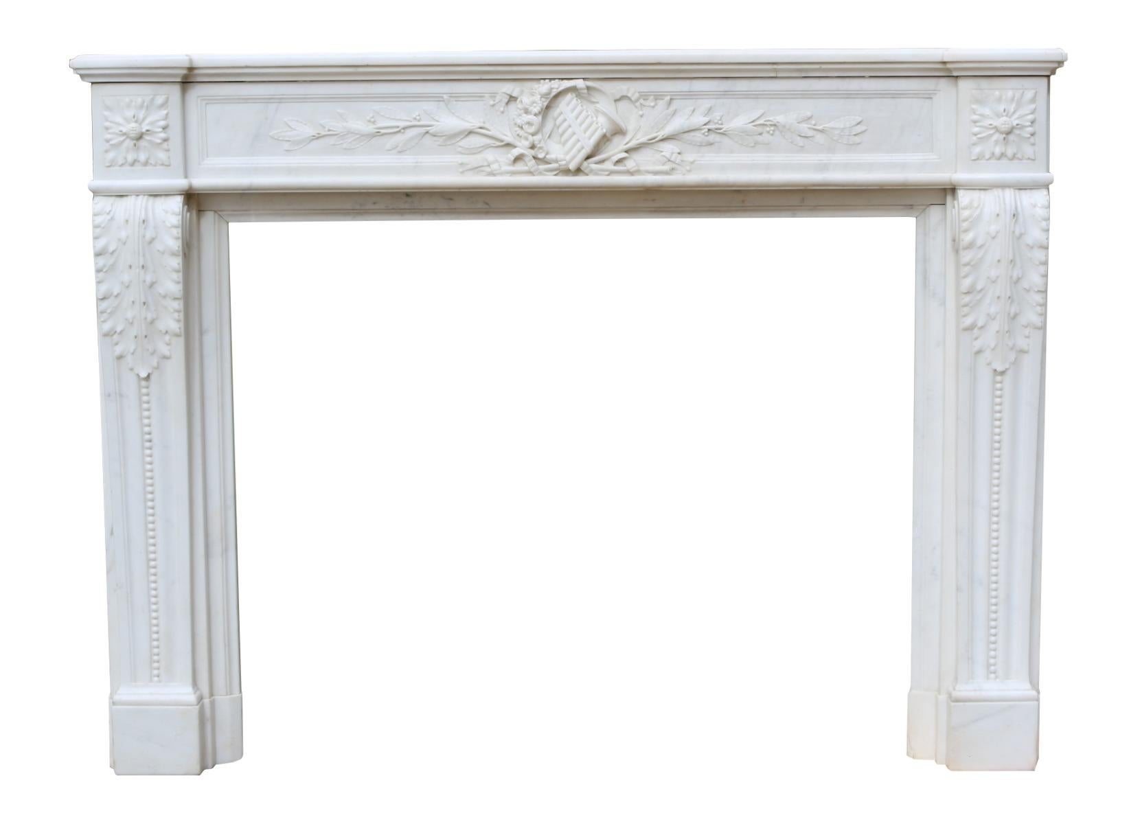 A good quality Carrara marble fire surround with a deeply carved frieze with pipes and French Horn carved to the centre. Reclaimed from a property in Surrey.

Measures: Opening height: 82 cm

Opening width: 101 cm.