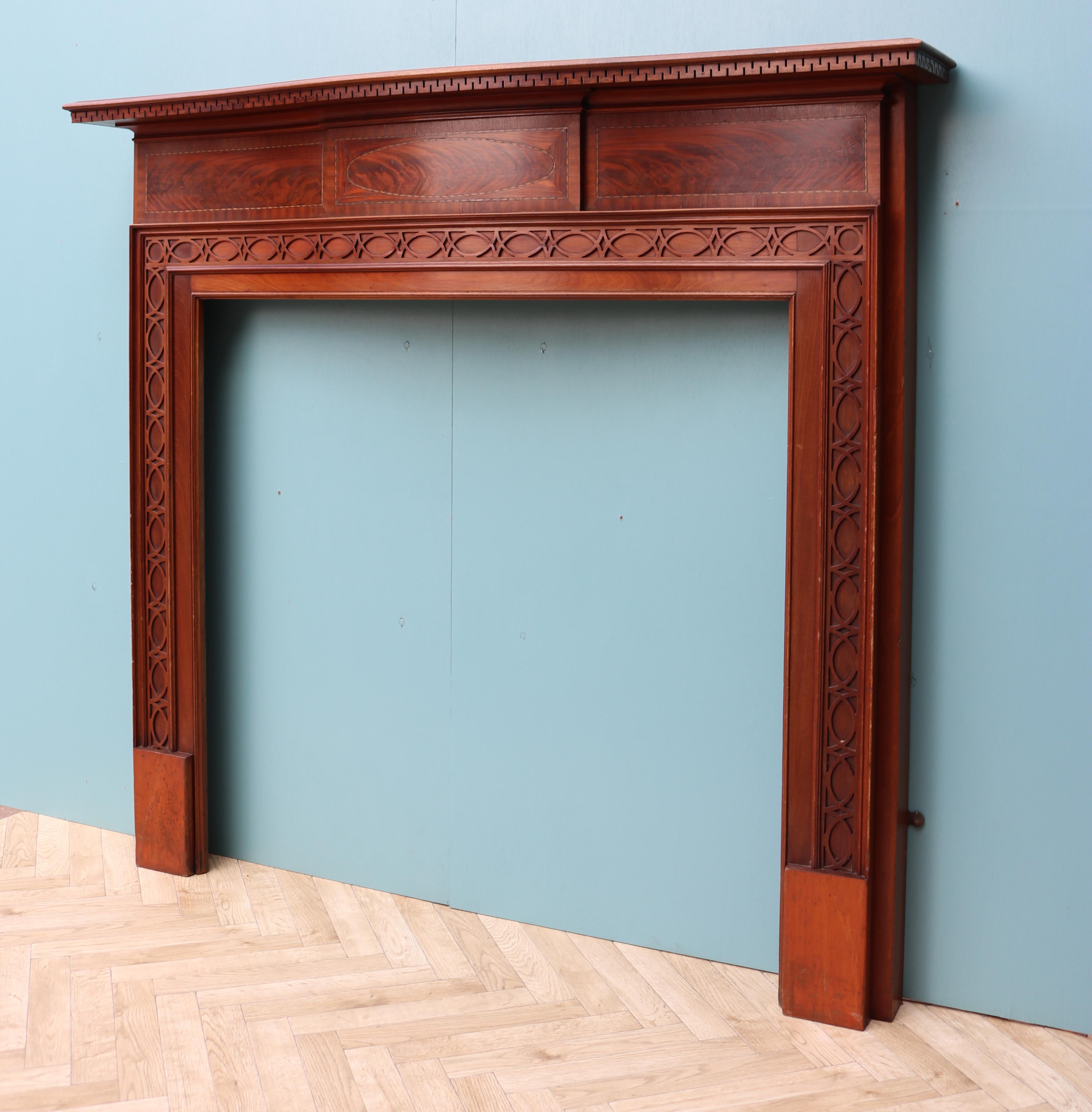 An early 20th century inlaid bow fronted flame Mahogany fire surround with fretwork panels in the Chippendale style.

Additional Dimensions:

Opening Height 102 cm

Opening Width 106.5 cm

Width between outside of legs 139 cm.