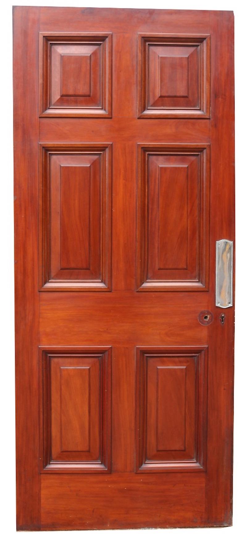 This beautiful Victorian Mahogany door has raised and fielded panels, chrome finger plate and a wax finish.