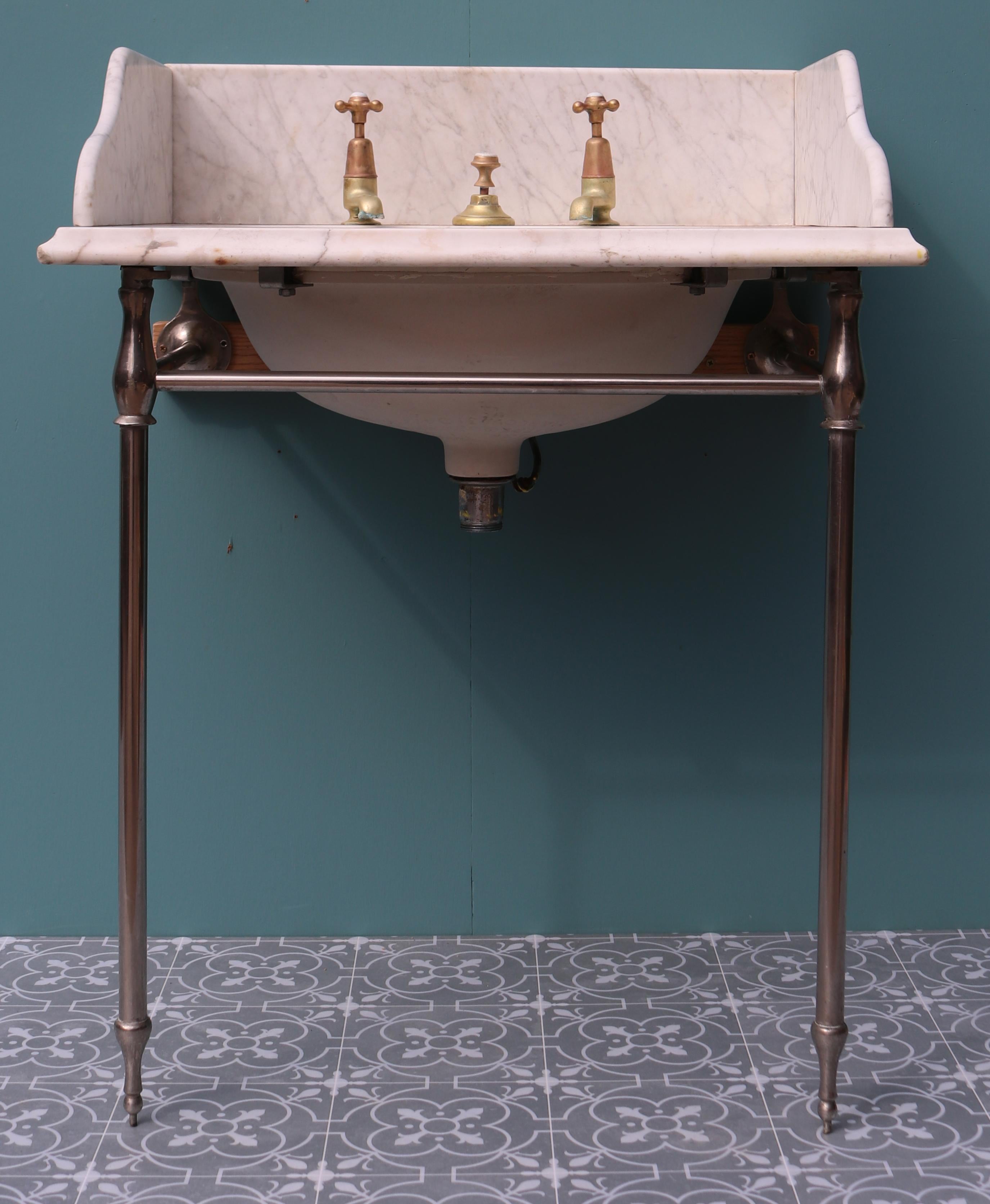 A Maple & Co. wash basin made from Carrara marble, with an under-mounted porcelain basin, fitted to a nickel-plated stand. This basin was salvaged from a house near Norwich.

Additional dimensions:

Splash back height 17.5 cm

 

Condition