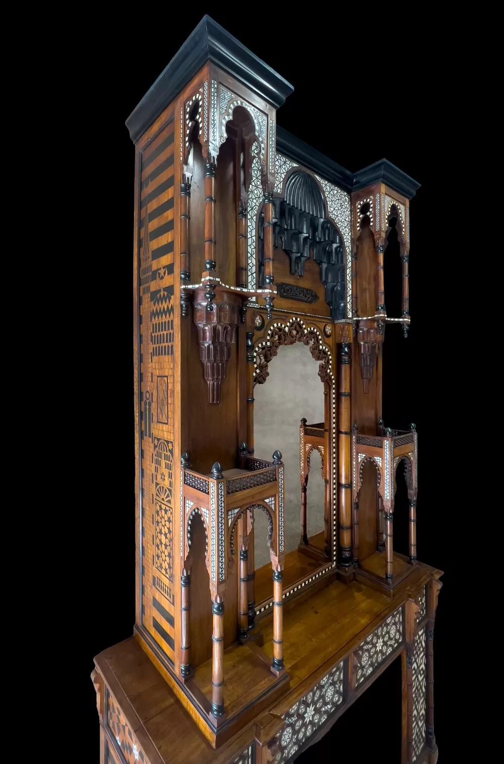 Moroccan An antique Moorish revival style walnut fireplace with inlays. For Sale
