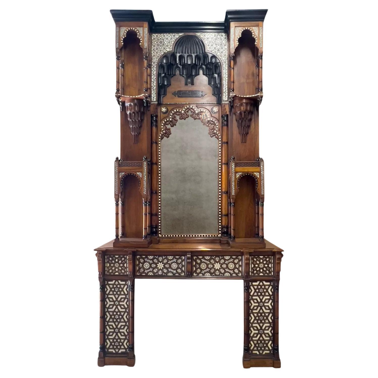 An antique Moorish revival style walnut fireplace with inlays. For Sale