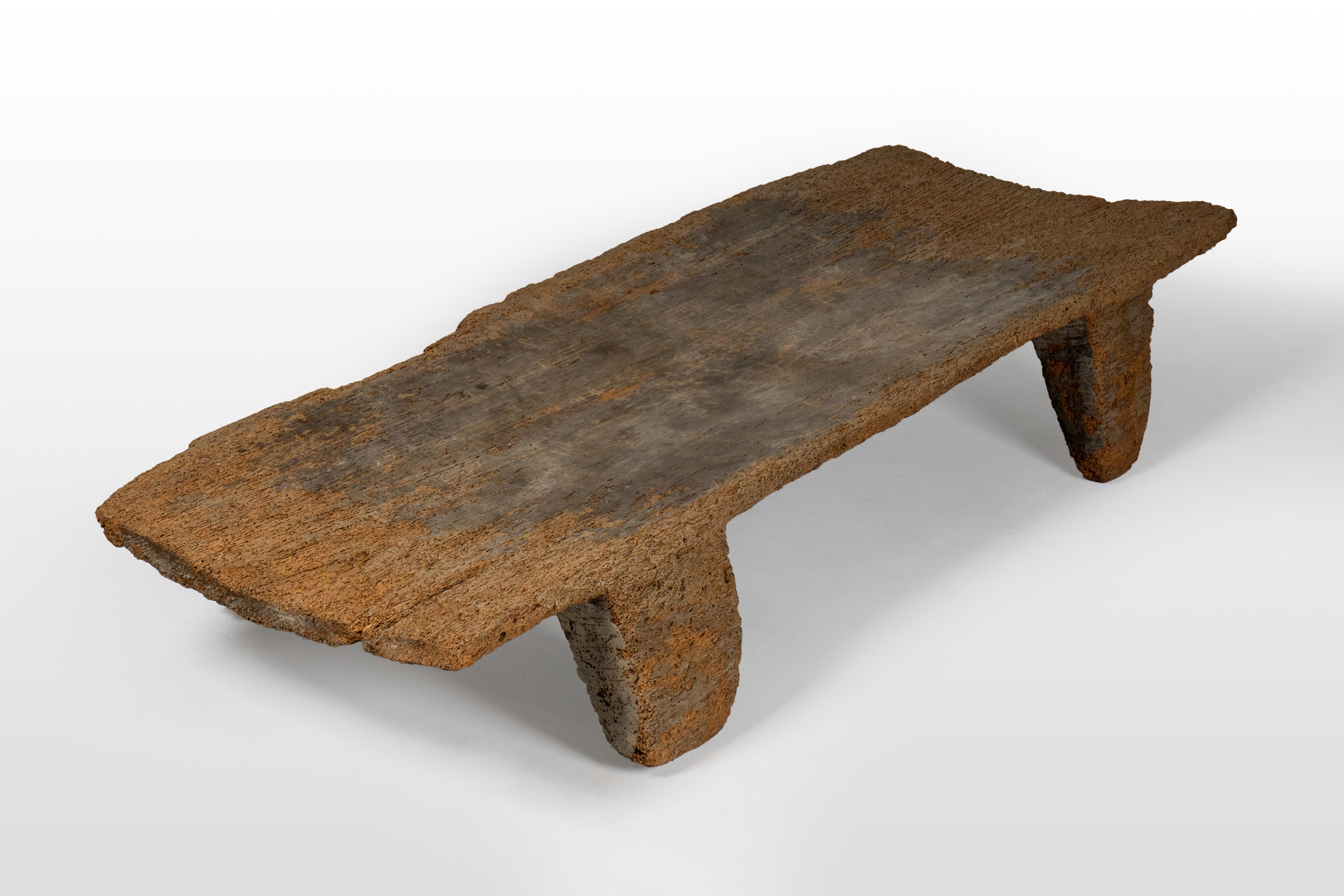 The Naga tribesman slept on elevated wooden beds to keep above the moist earth. Like most Naga artifacts, this bed is carved from a single piece of wood. The Naga people live in the north-eastern part of India and northwestern Myanmar in an upland