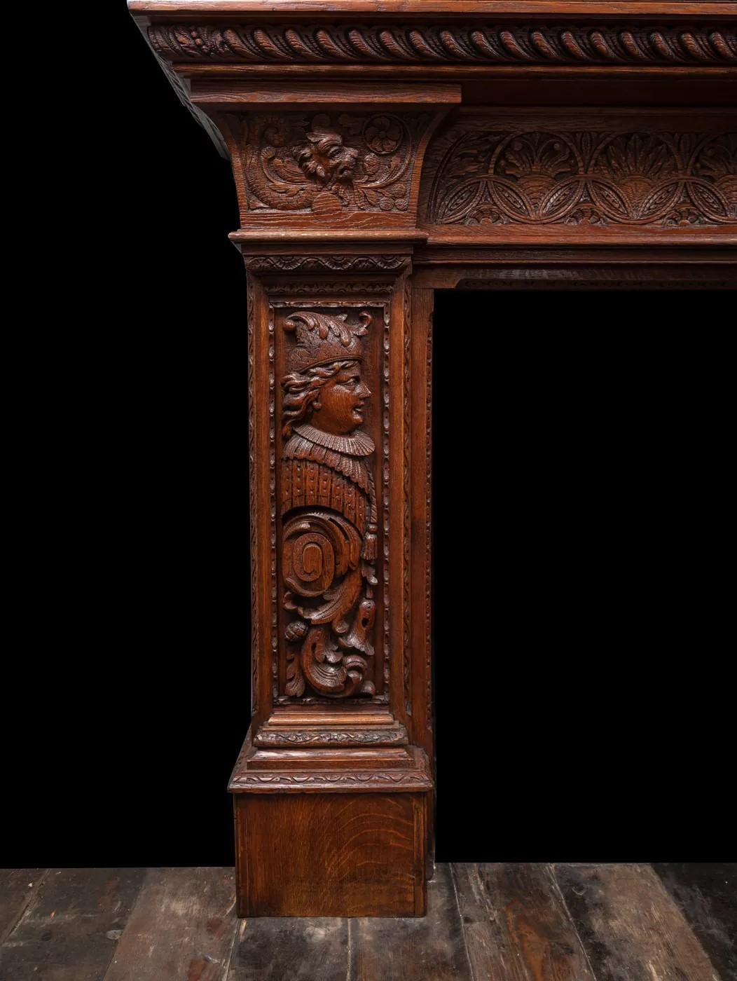 Renaissance Revival An antique oak fireplace surround, made in the Jacobean style. For Sale