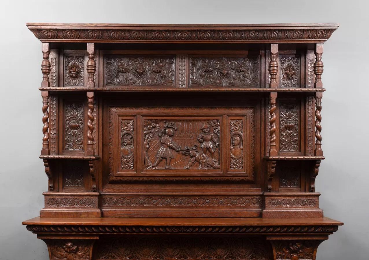 Carved An antique oak fireplace surround, made in the Jacobean style. For Sale