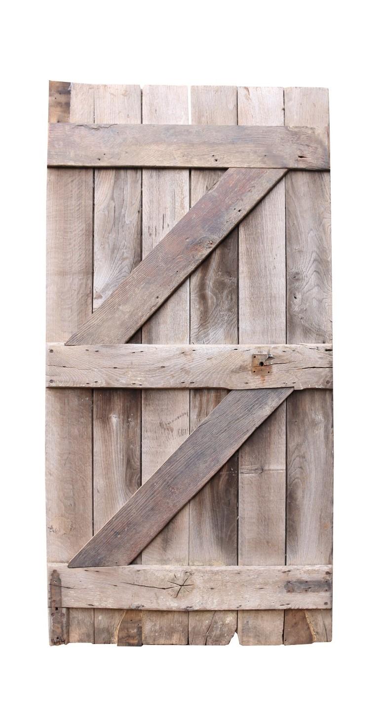 A beautifully weathered silver-grey oak door. Salvaged from a farmhouse in the Gloucestershire Cotswolds.