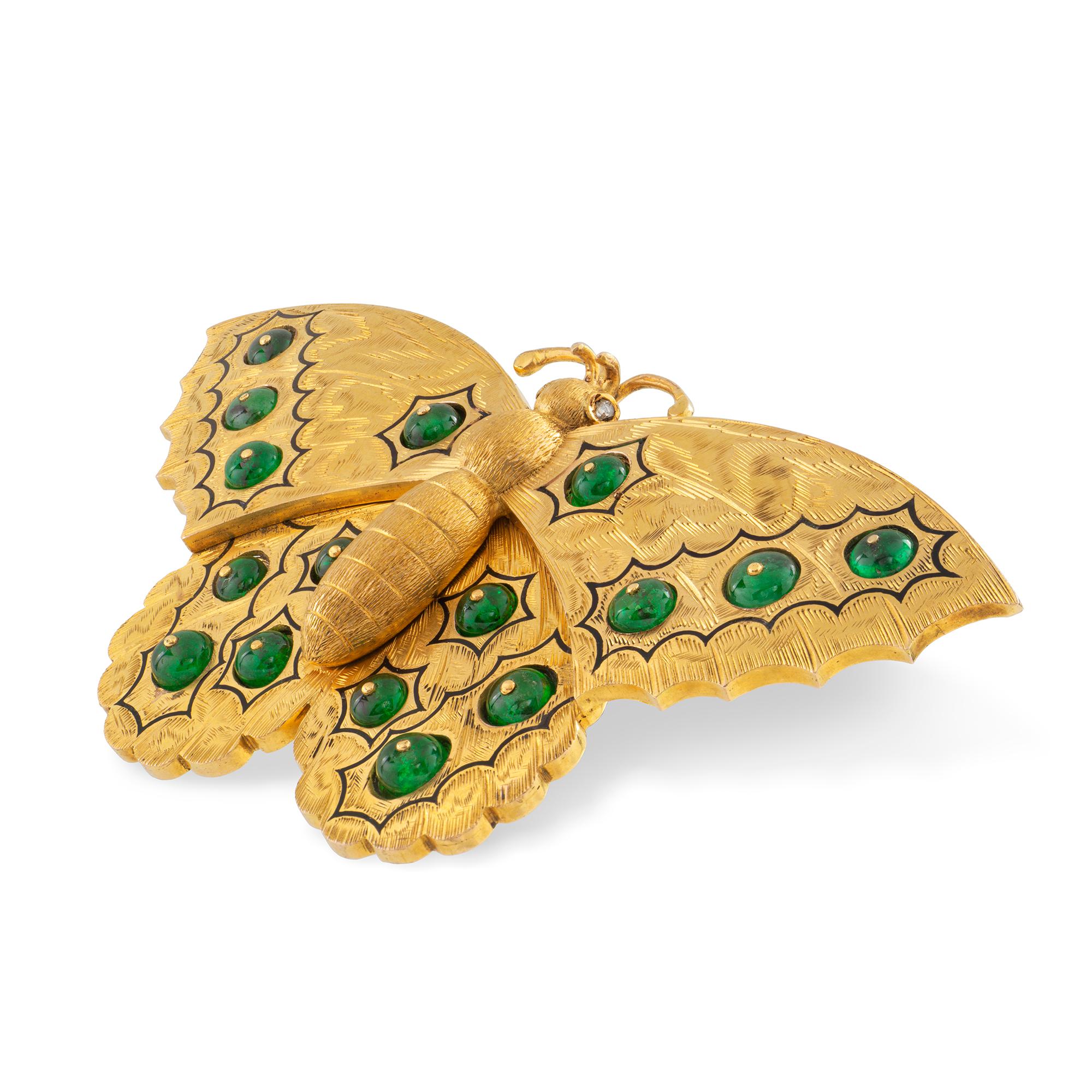 An antique Russian gold and emerald butterfly brooch, the wings set with sixteen emerald beads, all to a finely engraved background with black enamel decorations, all set in yellow gold mount with gold brooch fitting, measuring approximately 8x4cm,