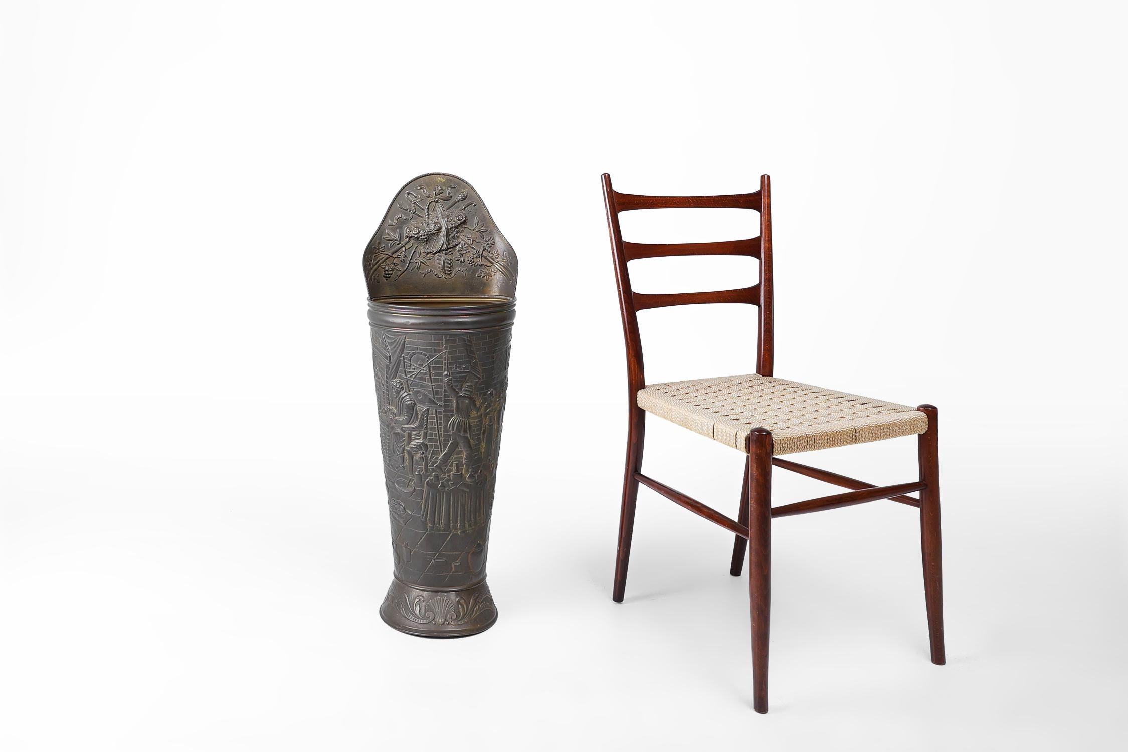 France / 1900 / umbrella stand / copper / Rustic / Mid-Century

An antique rustic ornate umbrella stand in copper. Crafted in France around 1900. 

This exceptional piece has an embossed image of various craftsmen working with bystanders in a