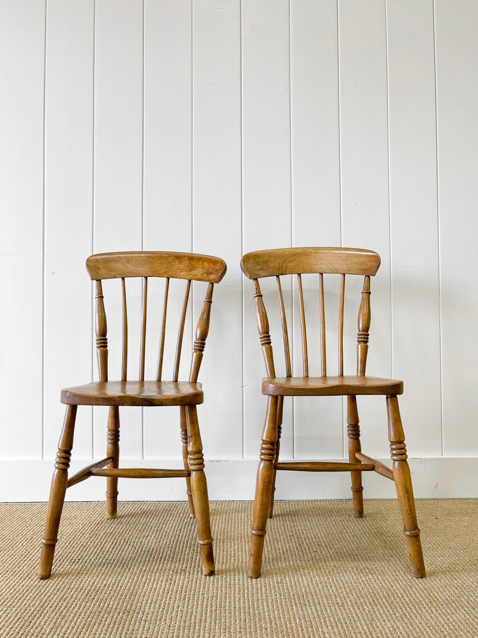 A good set of antique ash spindle back side chairs. Very solidly built in the traditional way.  Handsome profiles and good and heavy.  Perfect around a farmhouse table! Solid in joint. Beautiful figure in the wood, particularly the seats and back
