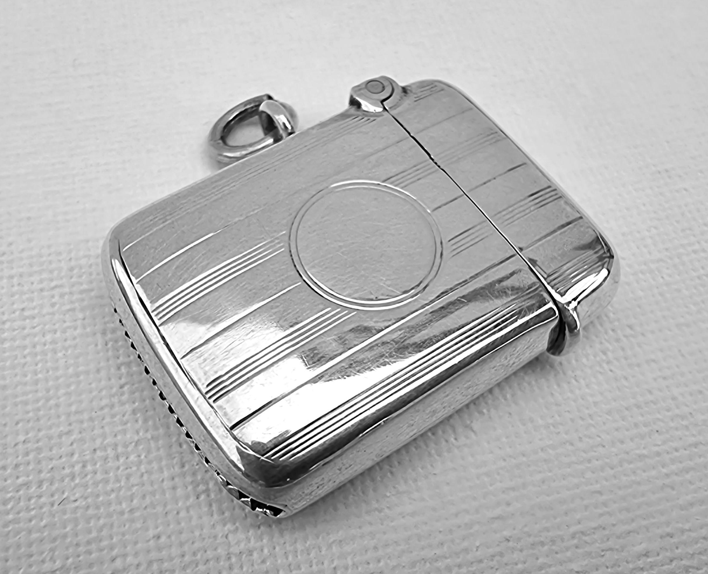 This fine silver vesta case is of an unusual rare small size. It measures Height 3.7cm x width 2.7cm x depth 1cm.  It is a high quality very solidly made example. Hallmarked for Birmingham 1920/21 by the famous silversmith William Hair Haseler.

It