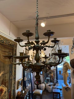 An Antique Spanish Two-Tier Bronze Twelve Light Chandelier, 19th Century
