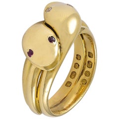 An Antique Victorian 18 Karat Gold double headed Snake Ring, Ruby & Diamond Eyes