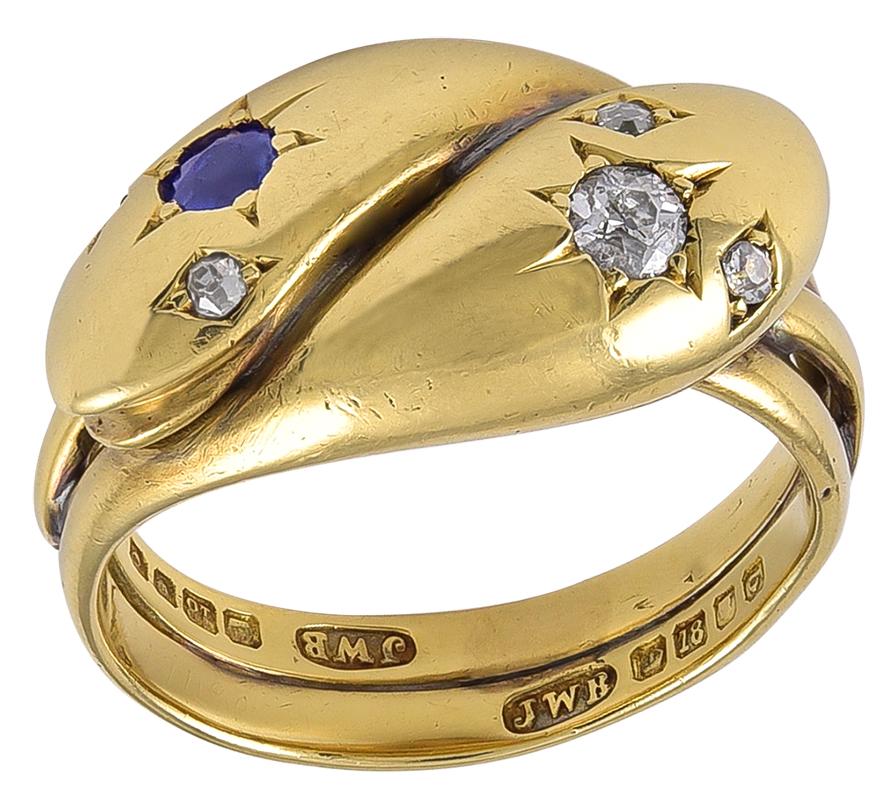 Each large head is set with Diamond Eyes and one head has an old European Diamond and the other is set with a Sapphire.
A quite heavy and substantial Ring and fully hallmarked for London 18k Gold and the date letter for 1879 and makers mark