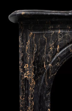 An antique Victorian period fireplace made from Portoro Nero marble
