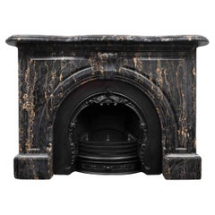 An Antique Victorian period fireplace made from Portoro Nero marble