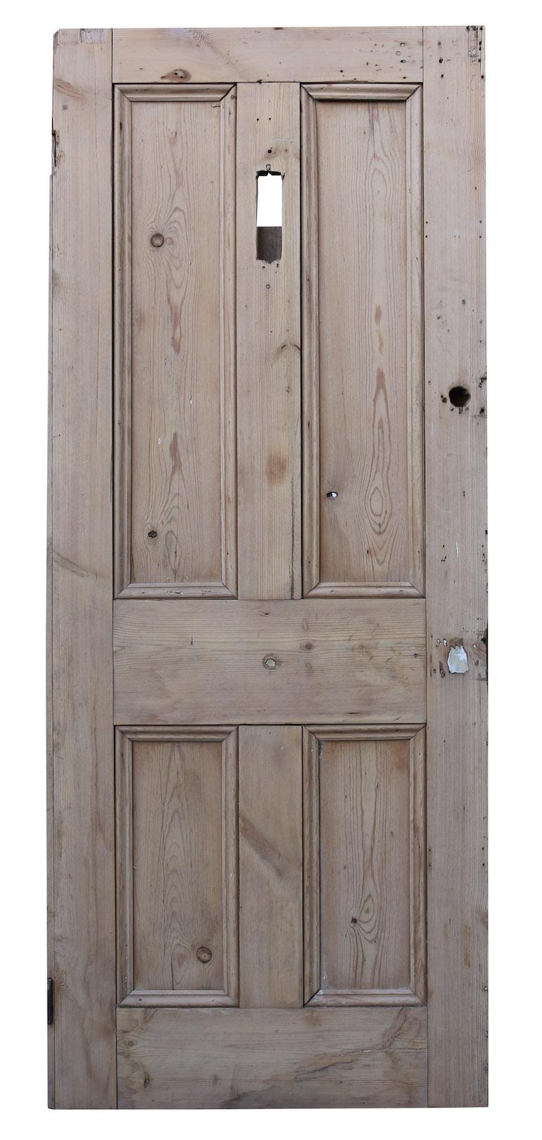 A reclaimed exterior door made from pine, with a stripped and sanded finish.