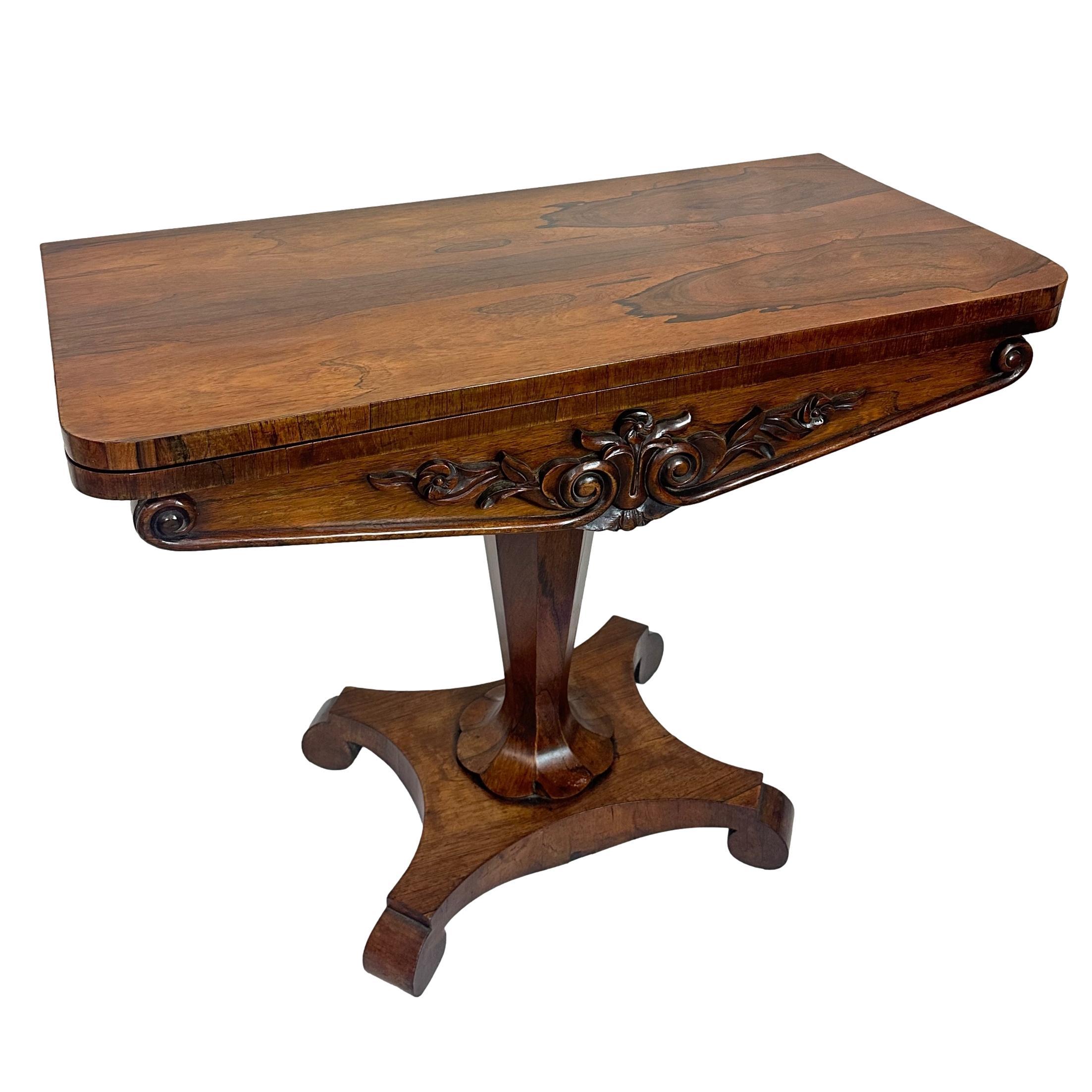An Antique William IV Rosewood Period Card Table and Side Table, the stunning figured rosewood top is beautifully preserved and French polished,  the apron/frieze with carved roses and leaves.  The central column formed as a tapered, flower-bottomed