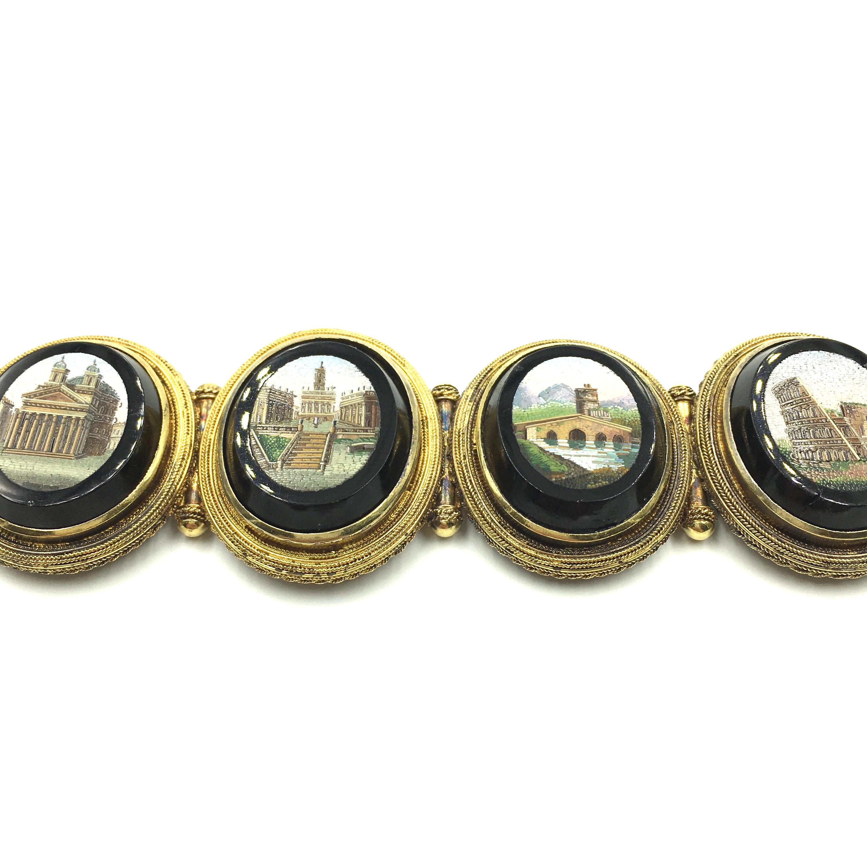An antique  yellow gold micro mosaic bracelet. Vatican School. Circa 1840. The bracelet is composed of (5) five oval shaped micro mosaics depicting Roman scenes.  The scenes are the following:  Pantheon, Campidoglio, Ponte Milvio, Colosseo and