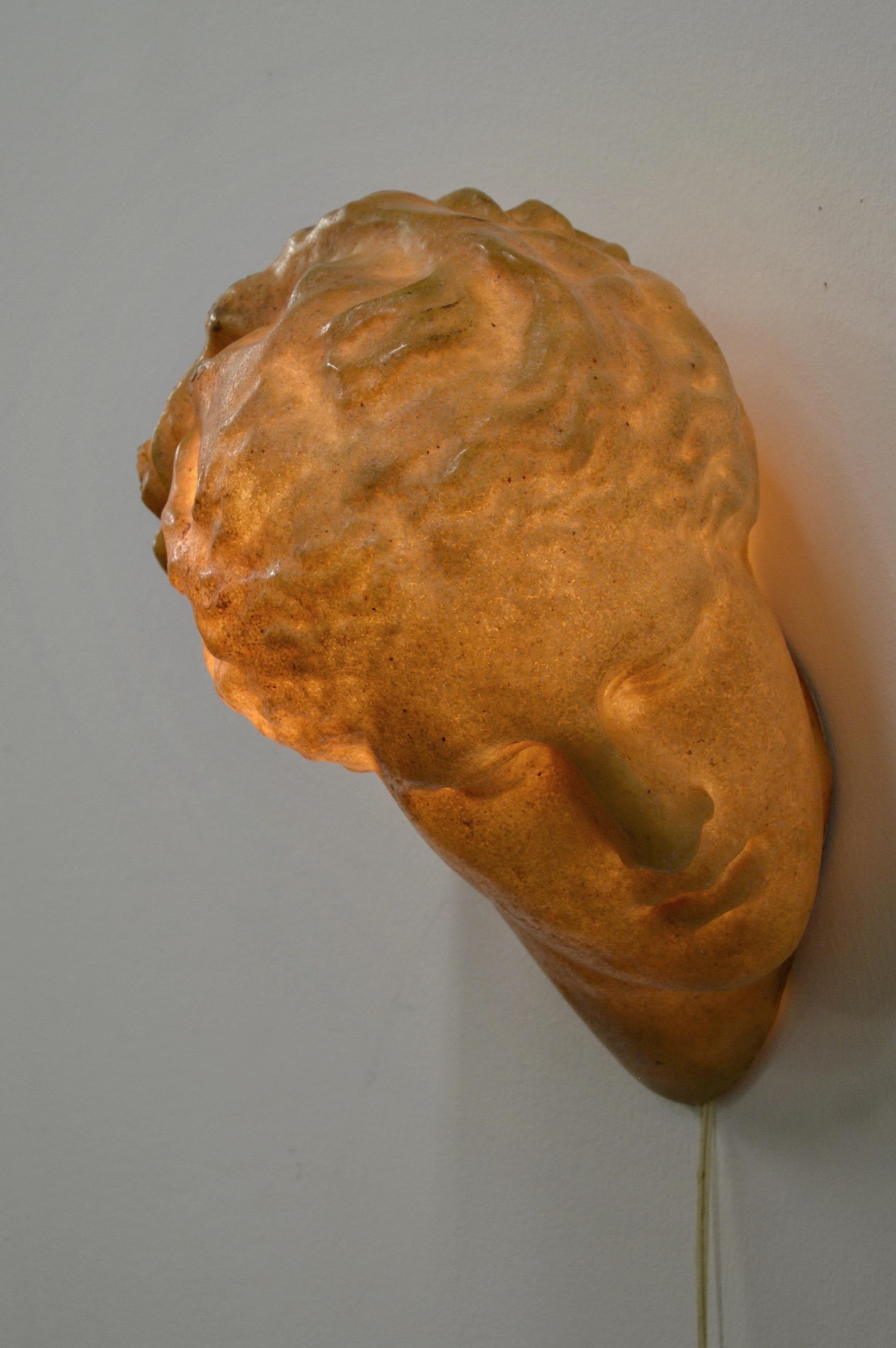 Rare “Aphrodite” wall lamp by André Cazenave for Atelier A, designed and produced in France circa 1970.
Crafted in fiberglass coated with marble powder, the piece presents a striking sculptural presence, evocative of an antique female bust. Its